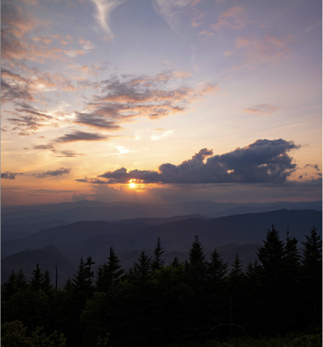 Golden sunrise lighting the Blue Ridge Mountains with fog in the valleys