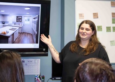 WCU student with a minor in construction management makes final presentation to REACH.