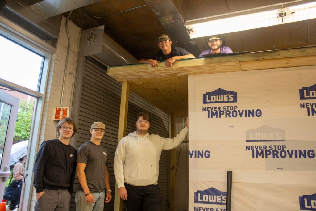 A team of WCU construction management students pose with a playhouse they designed and built with support from America's Home Place for AWAKE Children's Advocacy Center.