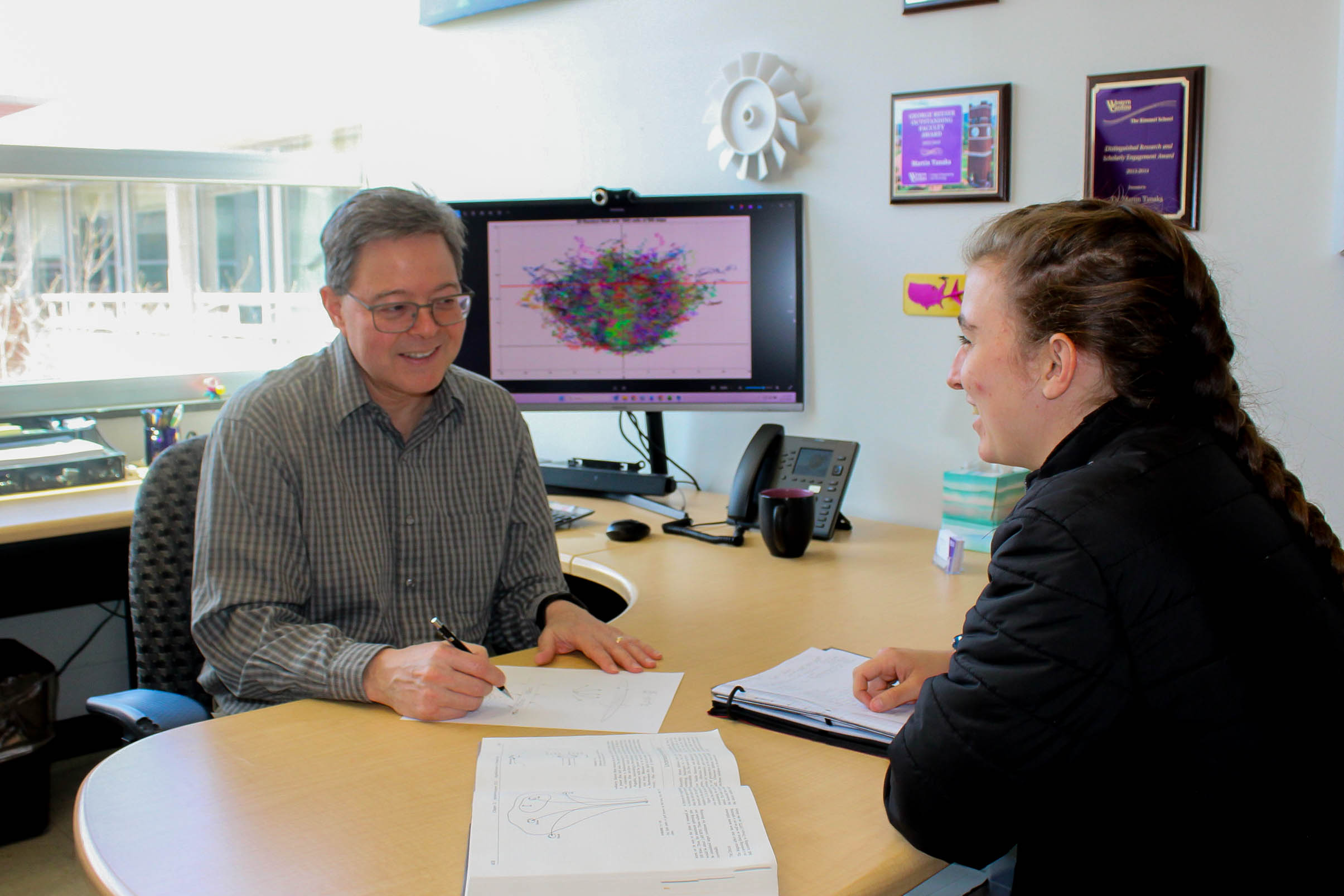WCU's Dr. Martin Tanaka meets with a student