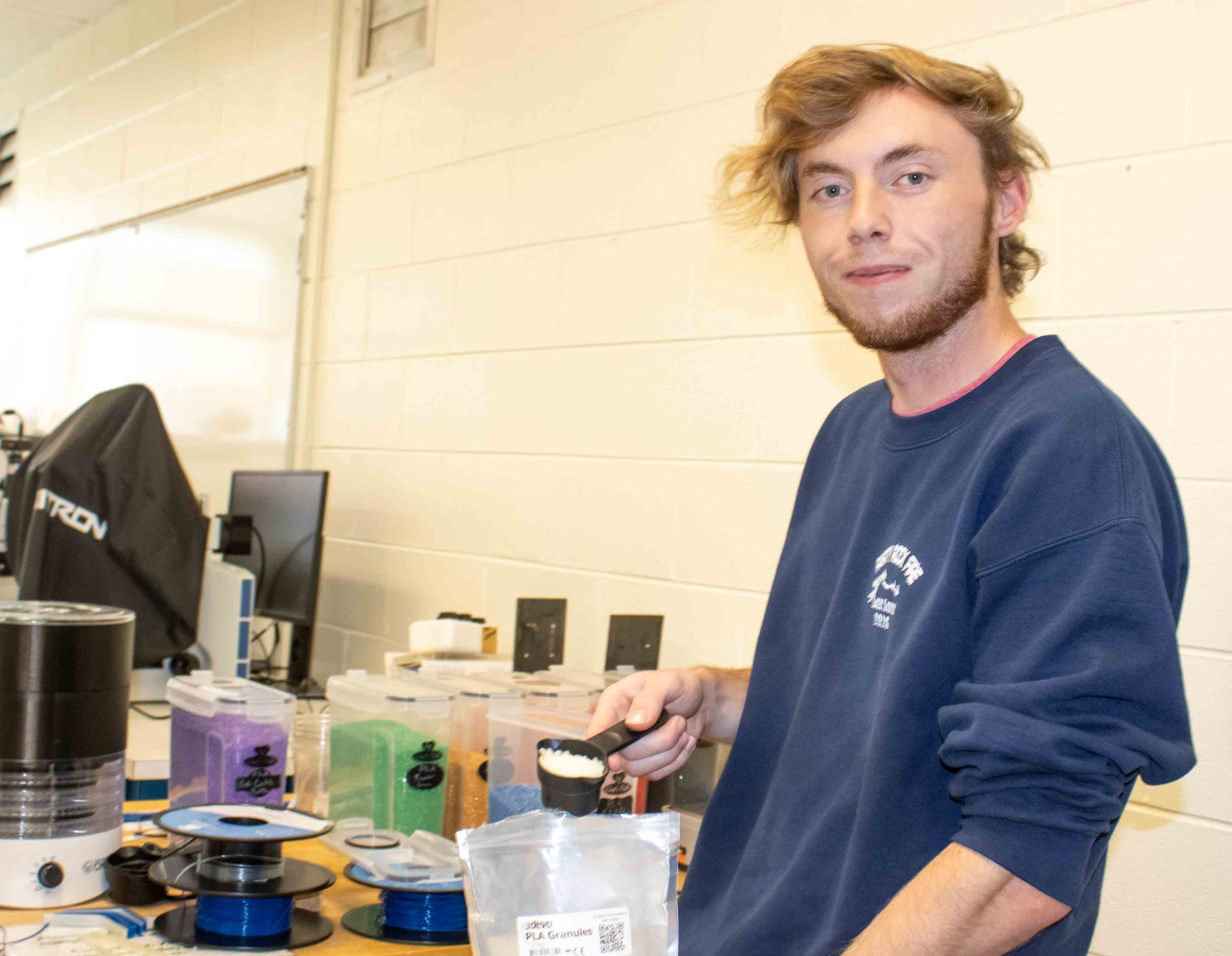 WCU MSET student Caleb Cole works on recycling system for discarded 3D printing material
