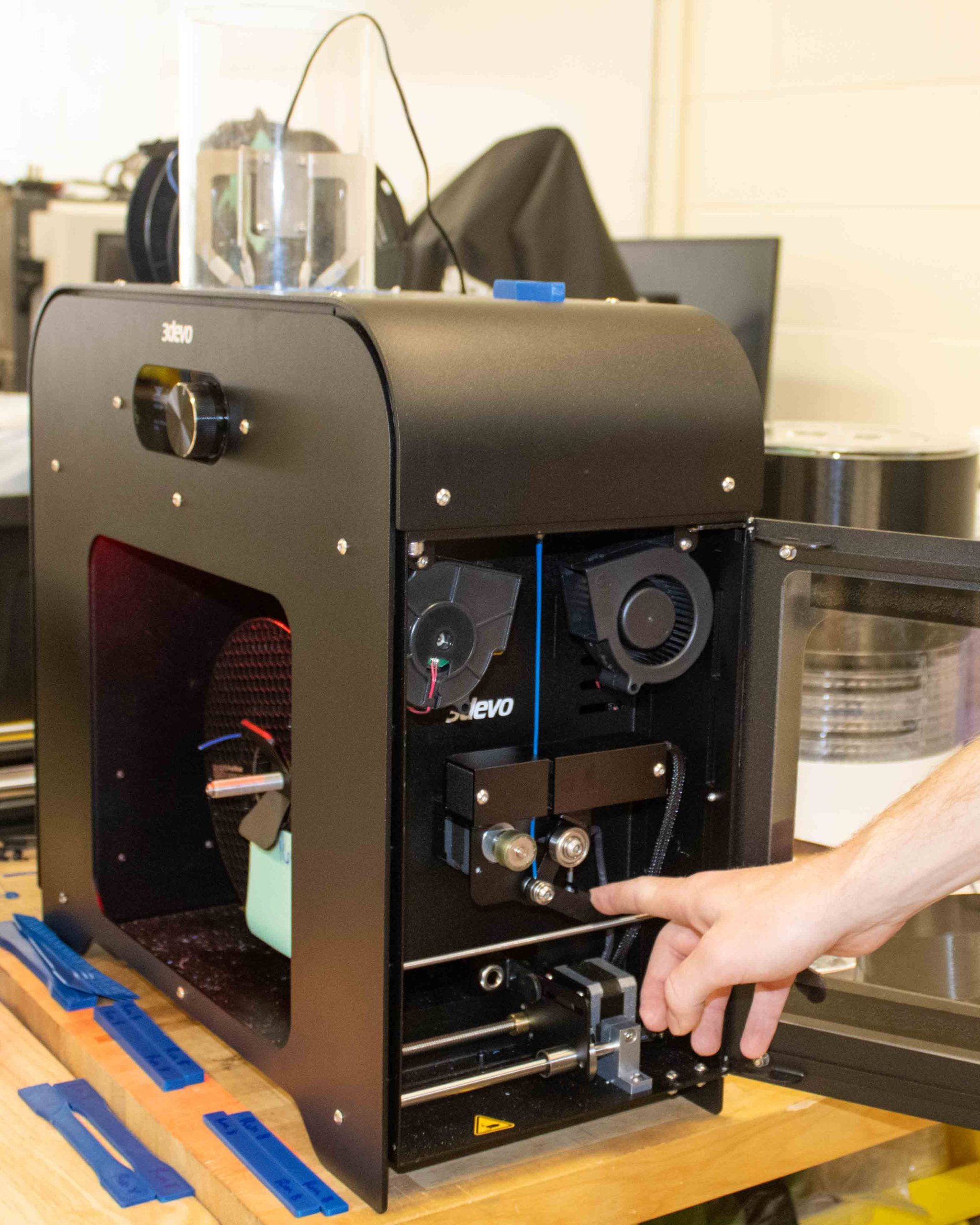 WCU MSET student Caleb Cole works on recycling system for discarded 3D printing material