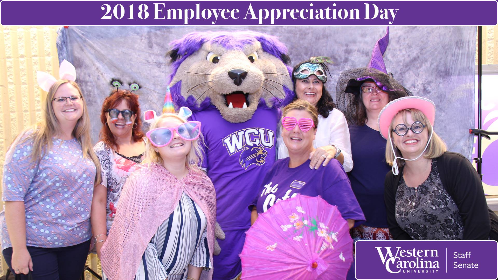 WCU staff members join Cats in taking a silly photo at Employee Appreciation Day.