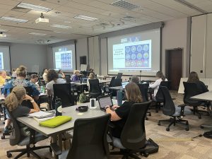 Educators listening to a presentation