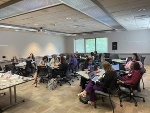 Educators listening to a presentation