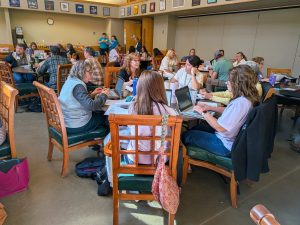 Groups of educators engaged in collaboration